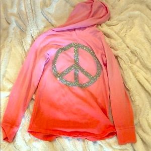 A hoodie with an peace sign on it